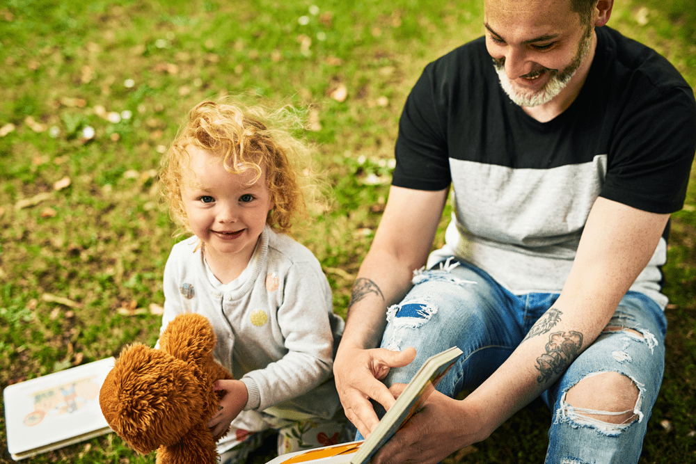 father and daughter smiling