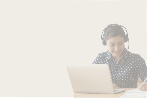 worker on laptop wearing headphones