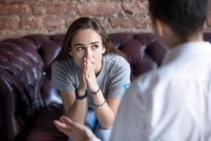 Mixed Race Teenager Talking To Counsellor or Teacher
