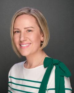 Relaxed woman with short blonde hair and a friendly smile for wellness and therapy.