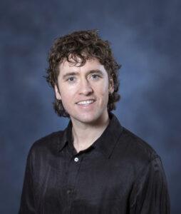Relaxed male portrait for wellness and health coaching.