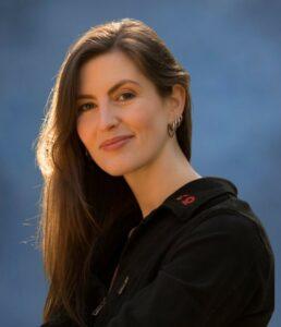 Serene woman practising mindfulness outdoors for relaxation and mental well-being.