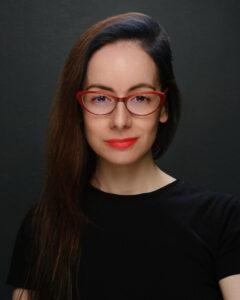 Mind and body wellness portrait, confident woman with glasses, professional health image.