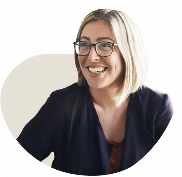 Woman smiling, practicing holistic health and wellness techniques.