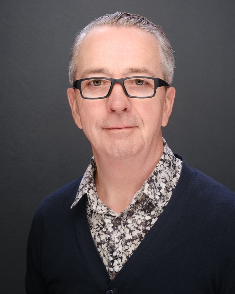 Focused man in glasses for mental health therapy, cognitive wellness.