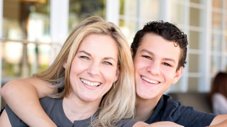 Happy mother and son smiling together, strengthening their bond in Ireland.