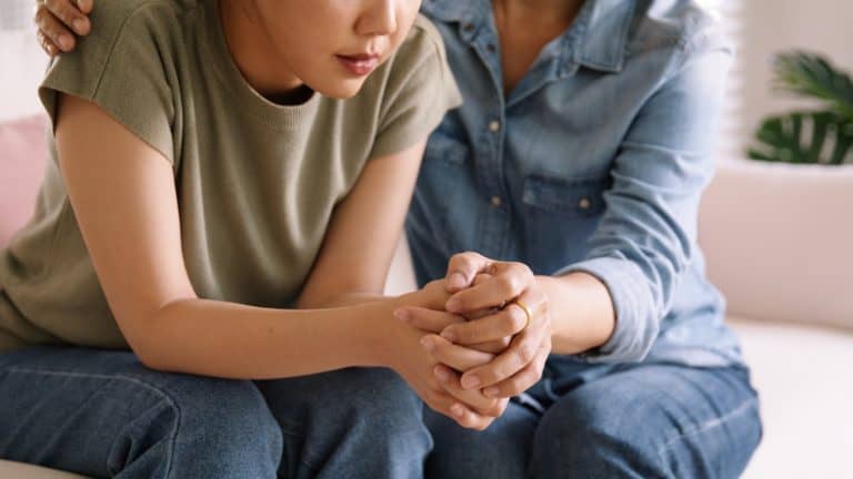 Therapist providing emotional support and guidance during a counselling session.