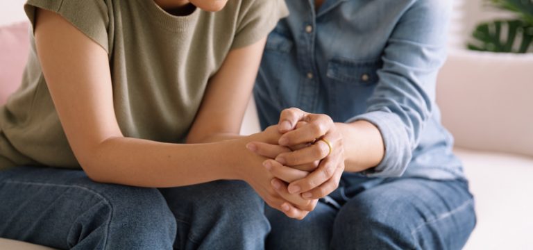 Therapist providing emotional support and guidance during a counselling session.